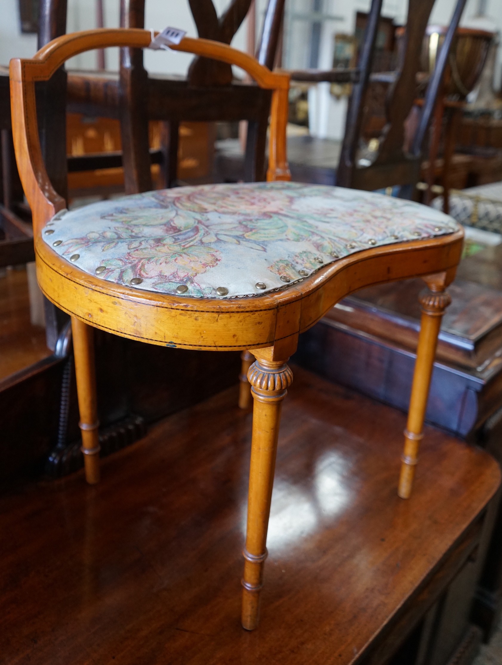 An Edwardian Sheraton revival satinwood dressing stool, width 61cm, depth 40cm, height 67cm